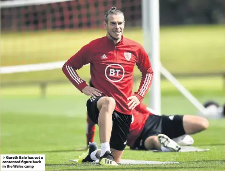  ??  ?? Gareth Bale has cut a contented figure back in the Wales camp