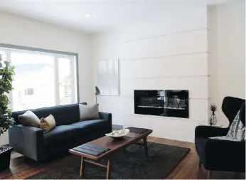  ??  ?? This D&S Homes show home in Brighton has plenty of family-friendly features, including a natural gas fireplace in the living room for guests to gather around.