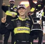  ?? Chris Graythen / Getty Images ?? Austin Cindric celebrates after capturing the Xfinity Series crown on Saturday at Phoenix. It was Cindric’s sixth victory of the season but first of the playoffs.