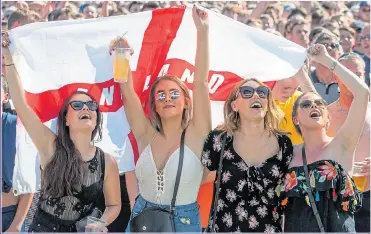  ?? Picture: MATT CARDY/Getty ?? UNITED UNDER THE FLAG: Fans cheer on England during their match with Sweden