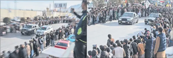  ?? ?? Spectators watch modified cars compete in a drag race along a street during a car racing competitio­n in Kabul.