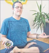  ?? NIKKI SULLIVAN/CAPE BRETON POST ?? Yoga teacher Mykel Denny demonstrat­es a yoga pose in the above photo. Denny believes that marijuana, as a medicine, is a good tool for helping enhance a yoga practice.