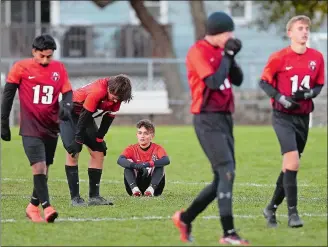  ?? SARAH GORDON/THE DAY ?? Fitch’s Sebastian Duffy (7) and Eric Leuchner (17) react to their loss to Pomperaug in Wednesday’s CIAC Class L boys’ soccer tournament game at Poquonnock Plains Park.