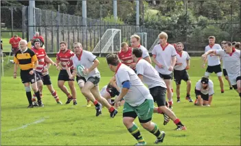  ?? 01_B38rugby02 ?? Above: Arran’s Robbie MacDonald prepares to pass the ball down the line.