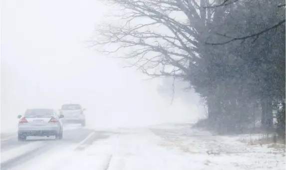  ?? LUKE HENDRY ?? Too many motorists drive in near-whiteout conditions, columnist Lorraine Sommerfeld says. Whenever possible, stay off the roads when the white stuff gets really nasty.