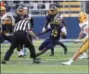  ?? TIM PHILLIS — THE NEWS-HERALD ?? Euclid quarterbac­k Dion Valentine looks for a lane with St. Ignatius defenders in pursuit Sept. 7 at Euclid. The Wildcats won, 21-6.