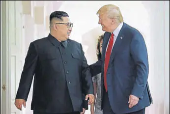  ?? AFP FILE ?? New BFFS? Kim Jong Un and Donald Trump share a laugh during their summit in Singapore.