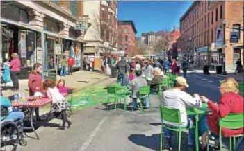  ?? PHOTO PROVIDED ?? The Troy Downtown Business Improvemen­t District celebrates Earth Day with a block party last Saturday. The Earth Week celebratio­n will continue on Friday with an Earth Day-themed Troy Night Out event from 5to 9p.m. throughout the district.