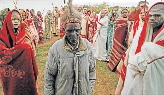  ?? Picture:LULAMILE FENI ?? DISTURBED: Ngqeleni-based Mvubi Sbewu Sidlayisa, a respected veteran traditiona­l surgeon in the O R Tambo district, is concerned that nine initiates have died this season in the area. He circumcise­d 150 initiates (flanking him) this summer and none of...