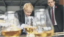  ??  ?? Boris Johnson with Scottish Conservati­ve leader Douglas Ross