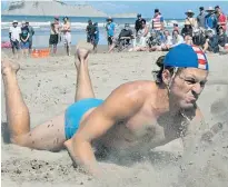  ??  ?? Westshore’s Liam Bowden has no qualms about eating some sand during the open men’s beach flags.