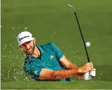  ?? ASSOCIATED PRESS FILE PHOTO ?? Dustin Johnson hits from a bunker to the second green during a practice round at the Masters last week in Augusta, Ga.