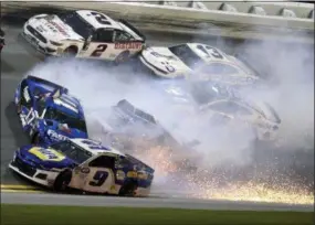  ?? GARY MCCULLOUGH — THE ASSOCIATED PRESS ?? Chase Elliott (9), Ricky Stenhouse Jr. (17), Brad Keselowski (2), Kyle Larson (42), Ty Dillon (13) and Alex Bowman (88) wreck in Turn 3 during the Daytona 500 at Daytona Internatio­nal Speedway, Sunday in Daytona Beach, Fla.