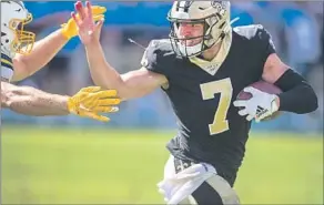  ??  ?? TAYSOM HILL, who is trying to learn to be an NFL quarterbac­k, last season played multiple positions for the New Orleans Saints. “It’s not an easy thing to balance,” he says.