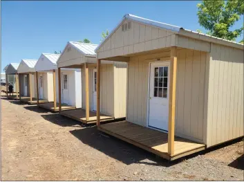  ?? RILEY BLAKE/ENTERPRISE-RECORD ?? Five shelters which will be used for Everhart Village sat prior to constructi­on in early June. The Community Housing Action Team held a public forum Wednesday to discuss the planned temporary housing village in Chico.