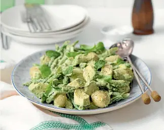  ??  ?? Potato and asparagus salad with creamy cashew basil dressing.