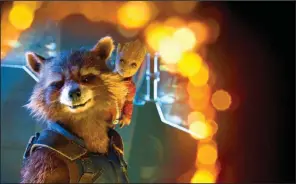  ??  ?? Rocket ( voice of Bradley Cooper) and Baby Groot ( voice of Vin Diesel) are temporaril­y separated from their team in James Gunn’s Guardians of the Galaxy Vol. 2.