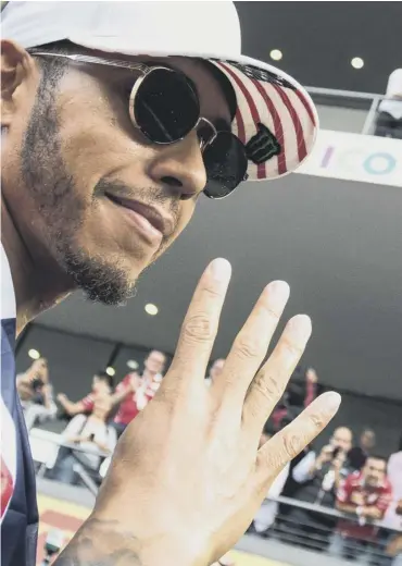  ??  ?? 0 Lewis Hamilton celebrates his fourth world title in Mexico on Sunday night, before heading to Miami.