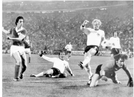  ?? AFP ?? Struggle between
brothers: East German forward Juergen Sparwasser (left) scores the winning goal past West German defenders Horst Hoettges (middle), Berti Vogts and goalkeeper Sepp Maier in 1974.