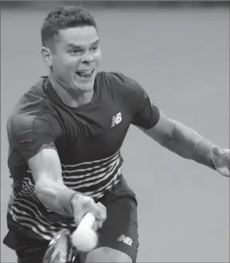  ?? JULIO CORTEZ, THE ASSOCIATED PRESS ?? Milos Raonic of Canada returns a shot to Dustin Brown of Germany in the first round of the U.S. Open tennis tournament Monday in New York. Raonic won to open the tourneyt, 7-5, 6-3, 6-4.