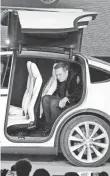  ?? FILE PHOTO BY ROBERT HANASHIRO, USA TODAY ?? Elon Musk sits in the back of the Model X at a launch event in Fremont, Calif., in 2015.