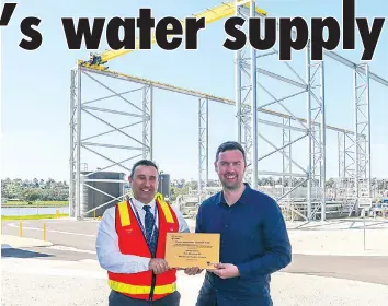  ?? ?? Member for Eastern Victoria Tom McIntosh (right) and Gippsland Water’s acting managing director Simon Acquilina mark the commission­ing of Drouin’s new $55 million wastewater treatment plant.