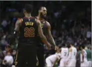  ?? ELISE AMENDOLA —ASSOCIATED PRESS ?? LeBron James and Jeff Green celebrate a play during the second half in Game 7 of the Eastern Conference finals against the Celtics on May 27.