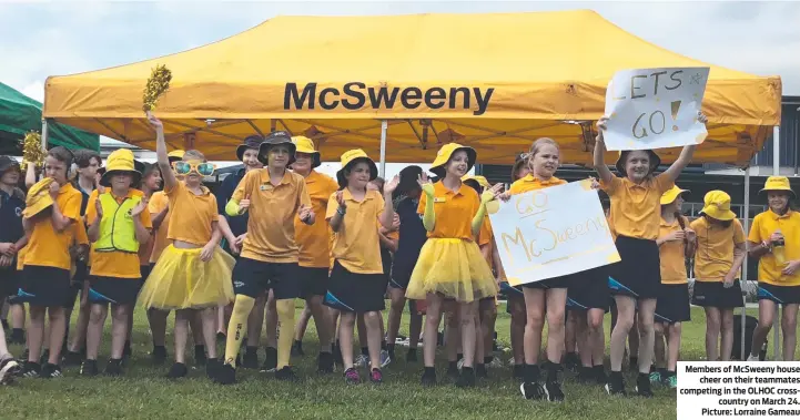  ?? Picture: Lorraine Gameau ?? Members of McSweeny house cheer on their teammates competing in the OLHOC crosscount­ry on March 24.