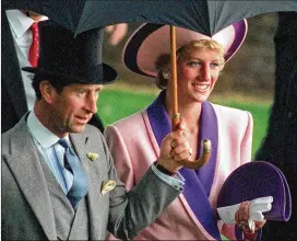  ?? MARTYN HAYHOW / ASSOCIATED PRESS 1990 ?? Britain’s Princess Diana and her husband, Prince Charles, take shelter under an umbrella in June 1990 while attending the Royal Ascot horse race. A new documentar­y on the late princess airs in Britain on Sunday.