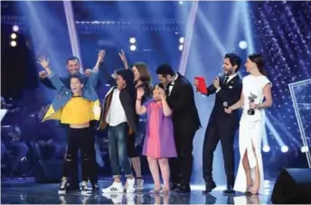  ??  ?? Moroccan Hamza Labyad (second left) reacts to being named the winner of season two of the ‘The Voice Kids: Ahla Sawt’ on February 3, 2018, at the Pan Arab Satellite MBC TV Station studios in Zouk Mosbeh, north of the capital Beirut. — AFP