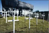  ?? ELIAS FUNEZ — THE UNION ?? The 73 crosses signifying COVID-19 deaths in Nevada County sit on the hill next to Old Barn Storage in Grass Valley on Tuesday.