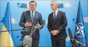  ?? ?? Ukraine’s Foreign minister Dmytro Kuleba (L) and NATO Secretary General Jens Stoltenber­g address the press during a meeting of NATO Foreign Ministers on Tuesday, in Bucharest, Romania.