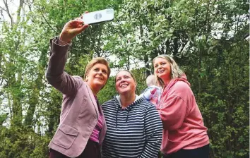  ?? AFP ?? Scotland’s First Minister and Scottish National Party leader Nicola Sturgeon (left) poses with voters after casting her vote in local elections, at a polling station, in Glasgow, yesterday.