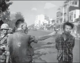  ??  ?? This photograph by Eddie Adams of the Associated Press, which won a Pulitzer Prize in 1969, shows South Vietnamese Gen. Nguyen Ngoc Loan executing Viet Cong officer Nguyen Van Lem.