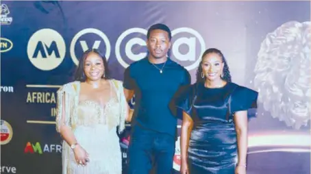  ?? ?? L-R: Toyosi Etim-Effiong, global director of content, MIPAD; Brandon Michael Hall, American actor, and Busola Tejumola, executive head, content and West Africa Channels at MultiChoic­e Nigeria ,at the first-ever AMVCA Runway Show recently.