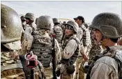  ?? ADAM FERGUSON / NEW YORK TIMES 2016 ?? Afghan National Army members stand in formation in March 2016. Afghan forces rescued 149 people Monday hours after the Taliban ambushed a bus convoy and abducted the passengers.
