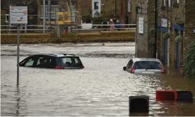  ??  ?? Flood water covers roads and car parks in Mytholmroy­d, West Yorkshire. Photograph: Oli Scarff/AFP via Getty Images