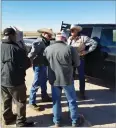  ??  ?? The suspect, Justin Tyler Greer, 36, is pictured being handed over to Tulare County Sheriff's Agricultur­al Crimes Detective Randy Gunderman, back to camera, from members of a Fugitive Task Force shortly after he was arrested in Tarzan, Texas.