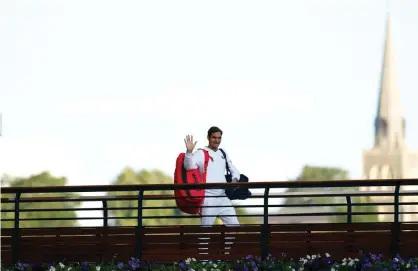  ?? Photograph: Adam Davy/PA ?? Federer waves to spectators at the All England Club.