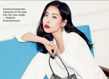  ?? — Makeus Entertainm­ent ?? Sunmi incorporat­es elements of city pop into her new single.