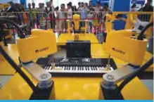  ??  ?? BEIJING: This file photo taken on August 15, 2018 shows robot arms playing music at the 2018 World Robot Conference.
