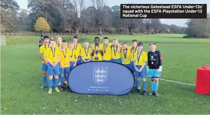  ??  ?? The victorious Gateshead ESFA Under-13s’ squad with the ESFA Playstatio­n Under-13 National Cup