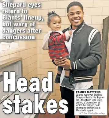  ??  ?? FAMILY MATTERS:
Giants receiver Sterling Shepard holds his 1-yearold daughter, Cali Clay during a promotion at which he helped build changing stations at a Manhattan park.