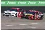  ?? RALPH FRESO — THE ASSOCIATED PRESS ?? Martin Truex Jr (19) and Brad Keselowski (2) race out of Turn 2 during a NASCAR Cup Series auto race at Phoenix Raceway, Sunday, March 14, 2021, in Avondale, Ariz.