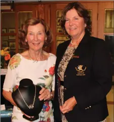  ??  ?? Joan Tully is presented with her prize by Lady Captain Susan Clark after she won the Division 3 category of the Lady Captain’s Prize at Laytown & Bettystown Golf Club.