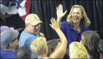  ?? MARK MAKELA / THE NEW YORK TIMES ?? Katie McGinty, Democratic candidate for U.S. Senate in Pennsylvan­ia, high-fives a supporter at a Hillary Clinton rally in Philadelph­ia in July. Various flaws mar many of the party’s candidates for Senate.