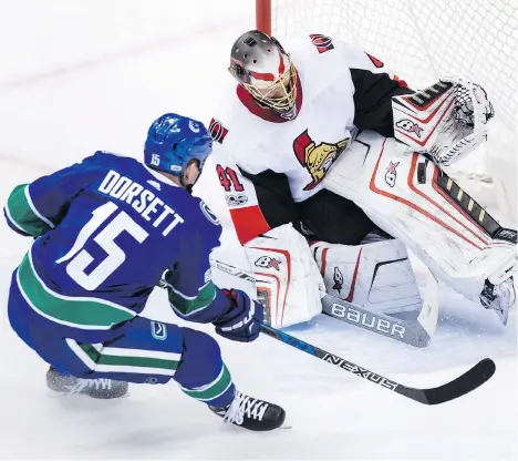  ?? DARRYL DYCK/THE CANADIAN PRESS ?? Ottawa Senators goalie Craig Anderson stops Vancouver Canuck Derek Dorsett at Rogers Arena on Tuesday night.