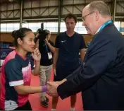  ??  ?? Le souverain a félicité la pongiste monégasque Xiaoxin Yang pour ses brillantes victoires.