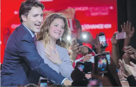  ?? DARIO AYALA / MONTREAL GAZETTE ?? Newly elected Prime Minister of Canada Justin Trudeau and wife Sophie Gregoire- Trudeau greet supporters at the Liberal Party election night headquarte­rs in Montreal on Tuesday, October 20, 2015.