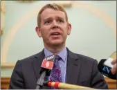  ?? MARK MITCHELL — NEW ZEALAND HERALD VIA AP ?? New Zealand Police Minister Chris Hipkins at a news conference in Wellington, New Zealand, on Thursday where New Zealand's government declared the Proud Boys and The Base terrorist organizati­ons.